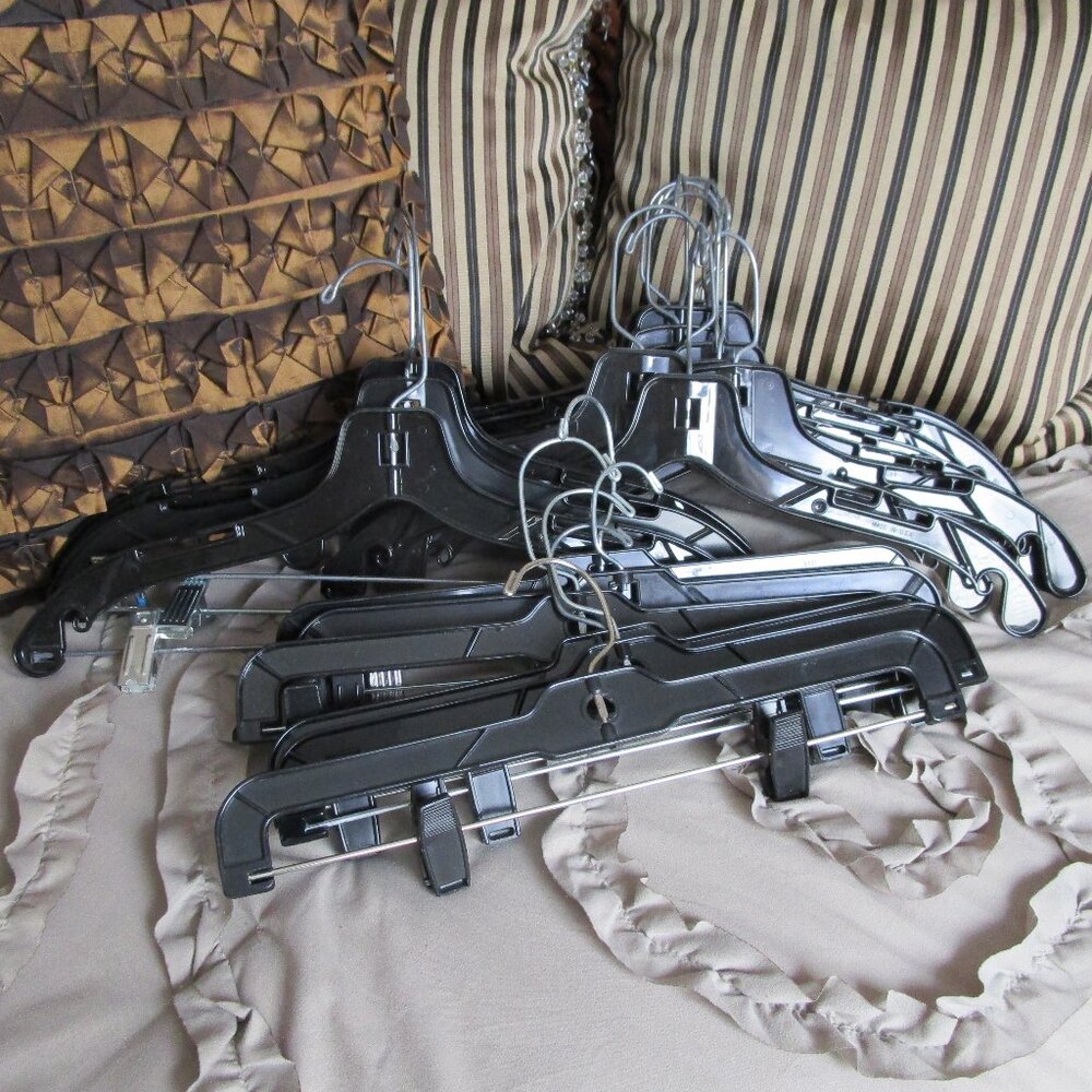 lot of black plastic hangers